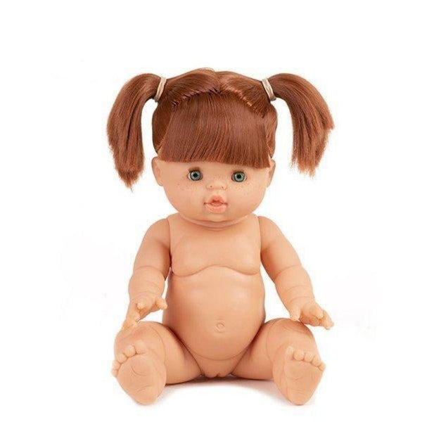 Red Head Minikane Baby Doll which is articulated and sitting down