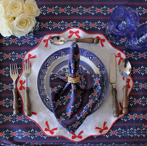 Elegant patriotic red, white, and blue striped table setting for July 4 2022