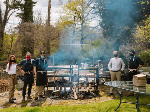 Open fire catering cooking meats outside 