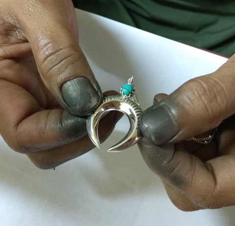 Artisan showing a gold ring