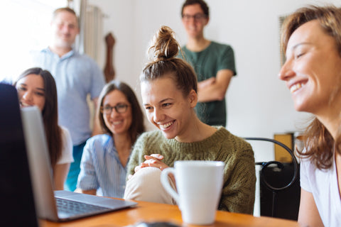 Happy people communicating at work