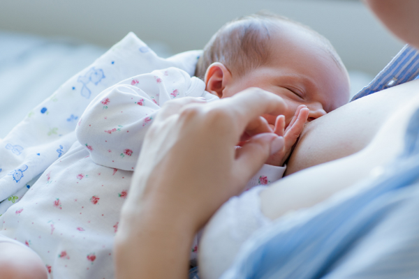 Mother breastfeeding baby