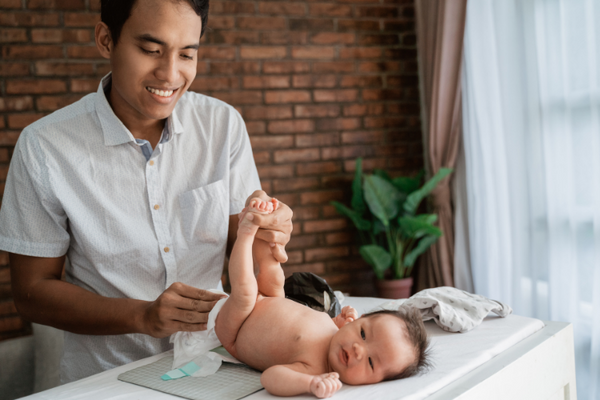 Father changing diaper