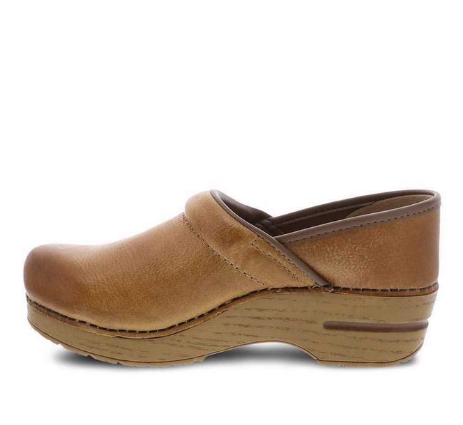 dansko honey distressed clogs