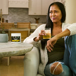 a woman drinking Organic Fiber Powder Pineapple Mango Flavor 