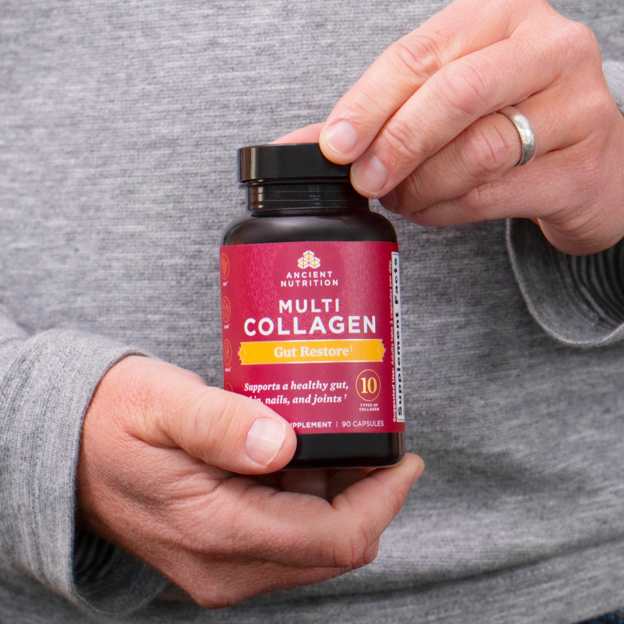 person holding bottle of Multi Collagen Gut Restore Capsules (90 Capsules)