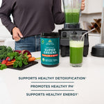 Organic SuperGreens Alkalize & Detox next to a blender