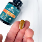 turmeric tablet in palm of hand