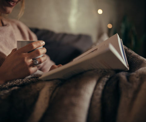 reading in bed for a sleep ritual