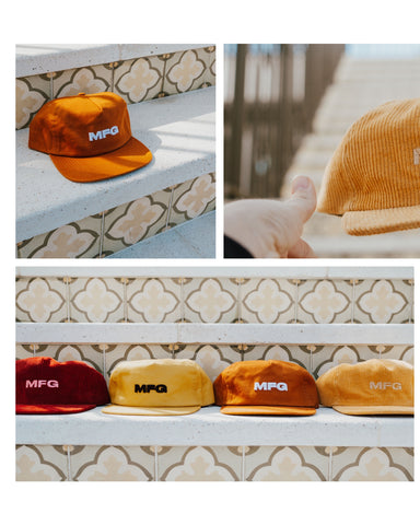 A variety of MFG Merch hats.  Multiple colors.