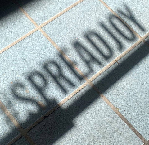 #spreadjoy shadow cast onto the floor of our store