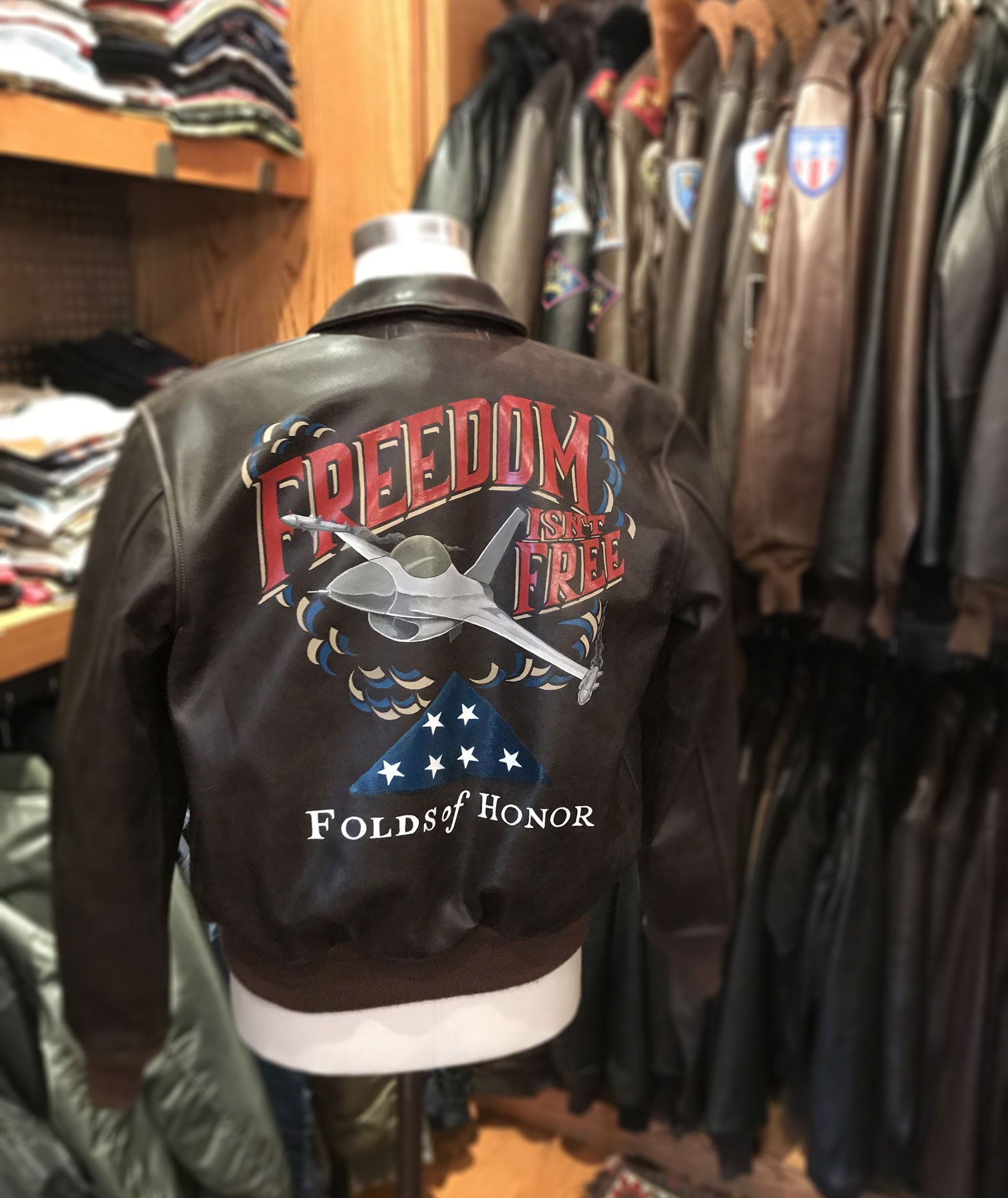 The finished hand painted Folds of Honor/Cockpit USA “Freedom isn’t Free” A-2 leather flight jacket