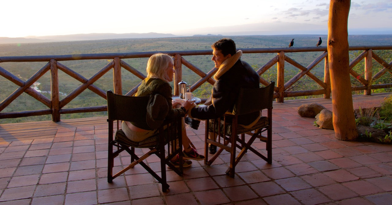 Matt Landis and his wife, Jen watching the sunset while on safari with Don Young.