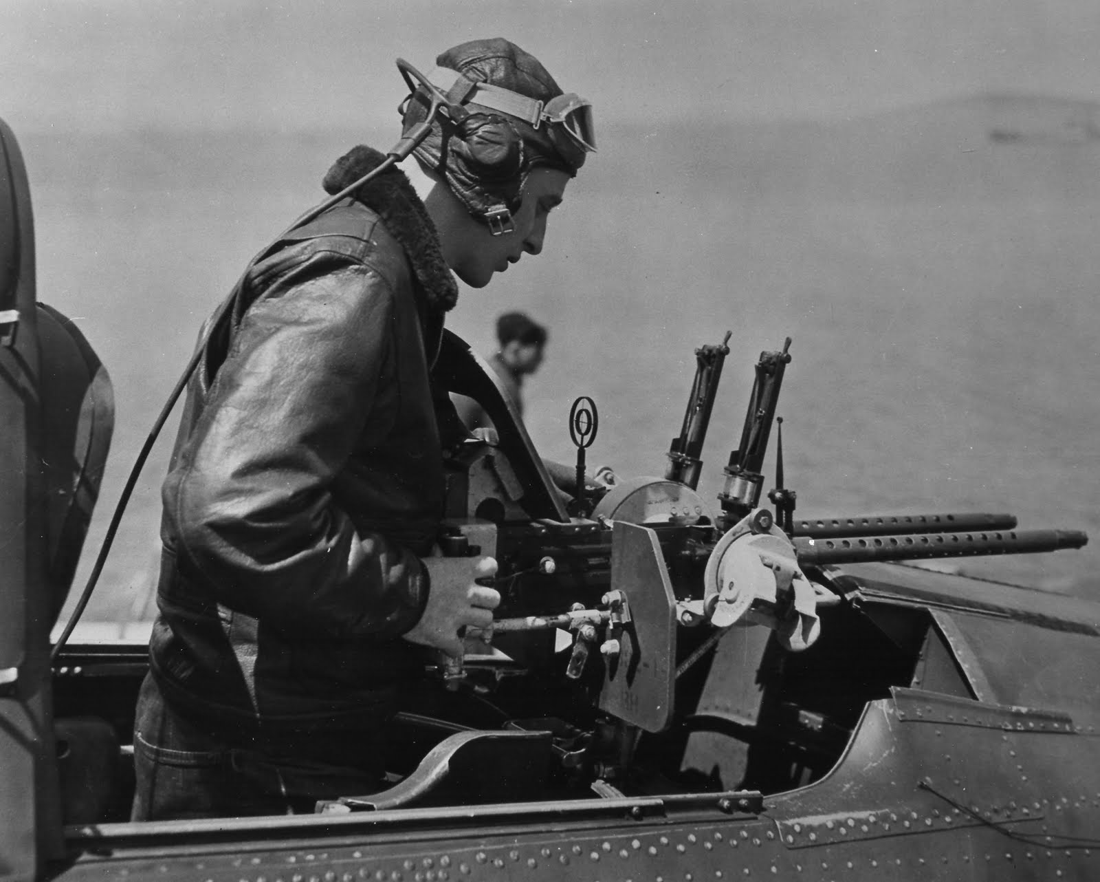 Gunner pilot checking his weapon