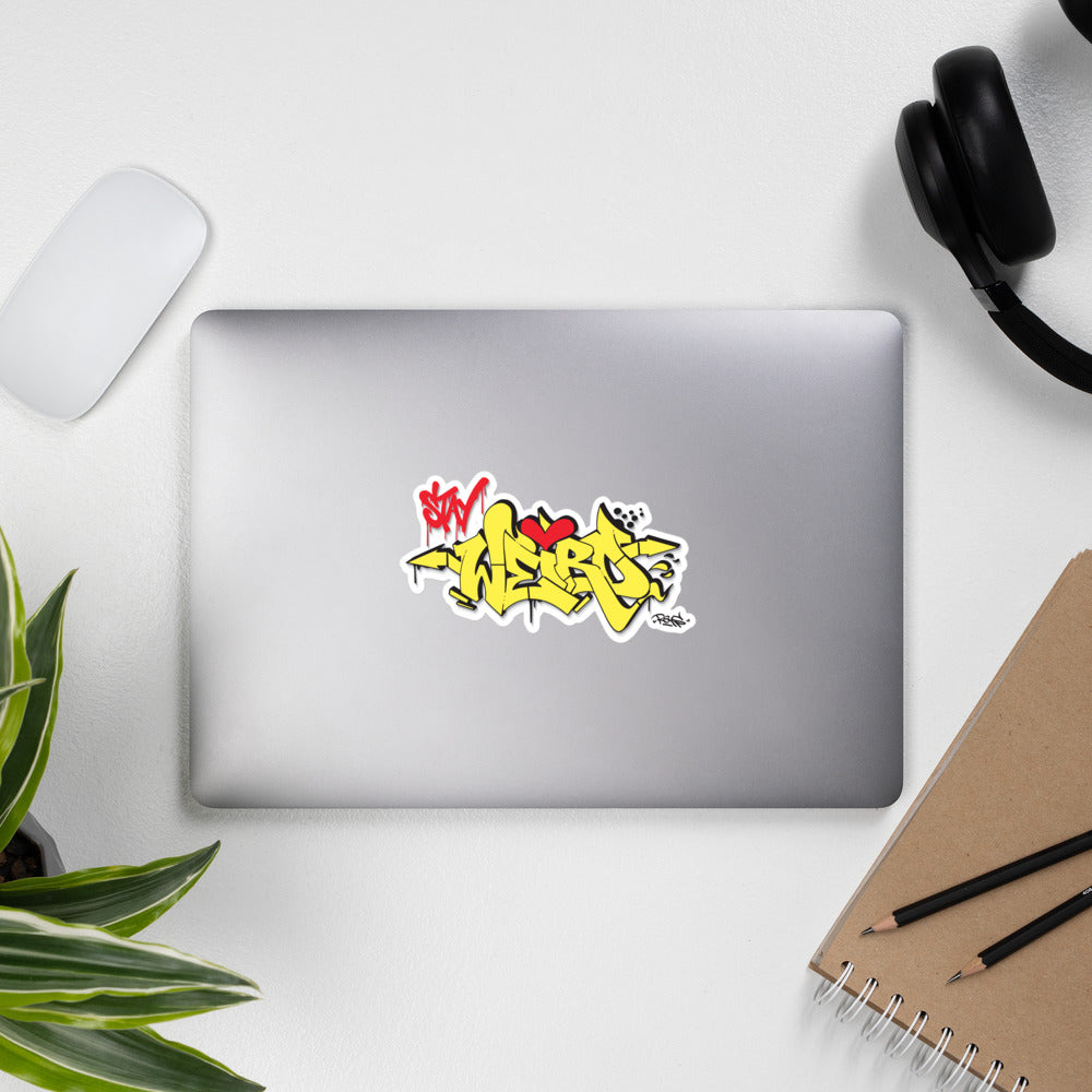 laptop with sticker Stay Weird yellow Reys by B.Different Clothing independent streetwear inspired by street art graffiti