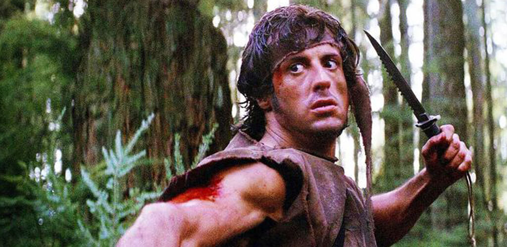 Rambo: First Blood Knife - Sylvester Stallone as Johnny Rambo holding the iconic Rambo Knife