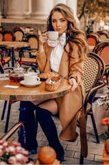 woman drinking coffee during autumn