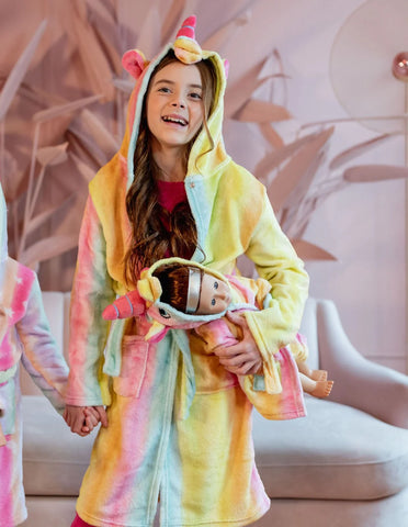 Happy little girl wearing a robe