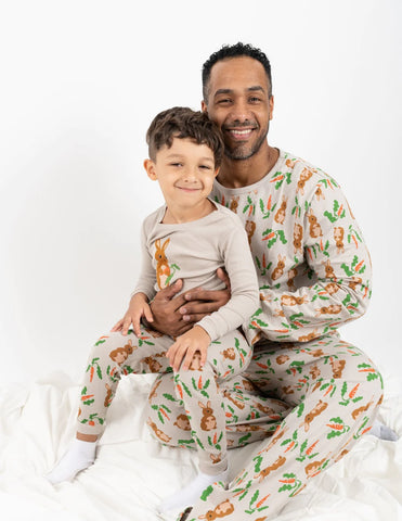 Father and child bonding in matching pajamas from Little Sleepies collection.