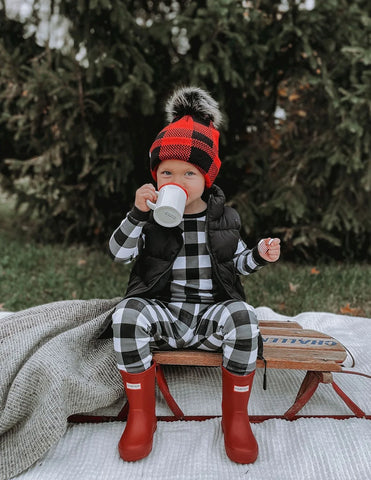 Baby in a Santa outfit with festive decorations