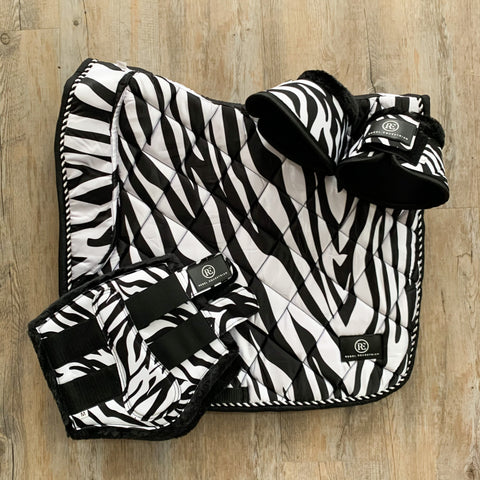 rebel equestrian zebra dressage set saddle pad bushing boots bell boots 