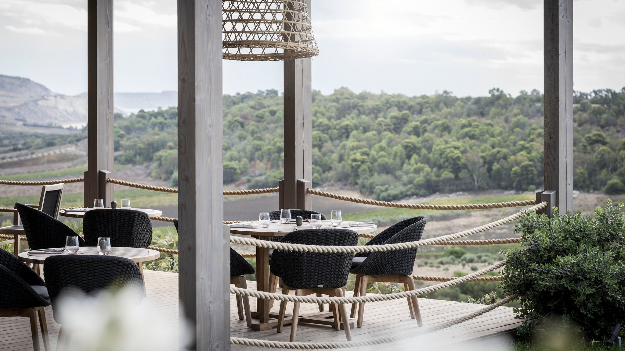 Adler Spa Resort Sicilia dining area featuring Cane-line Peacock outdoor chair