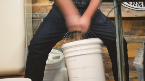 aerating our wort for the last time by shaking it up in the fermenter