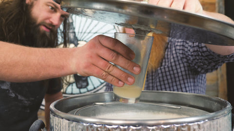 taking a sample of wort during the mash to measure PH