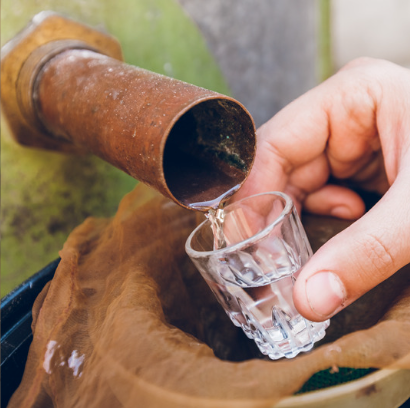 pouring moonshine into a glass