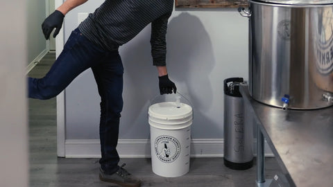 placing fermentation bucket on the floor for a room temperature fermentation