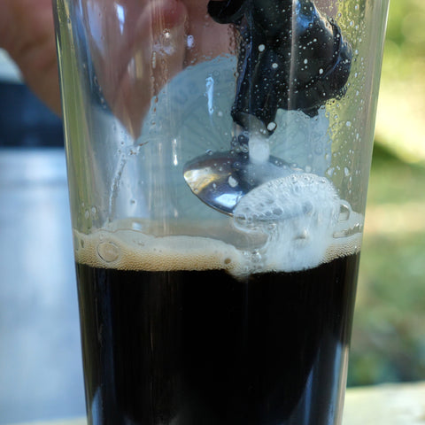 pouring cider with a spoon