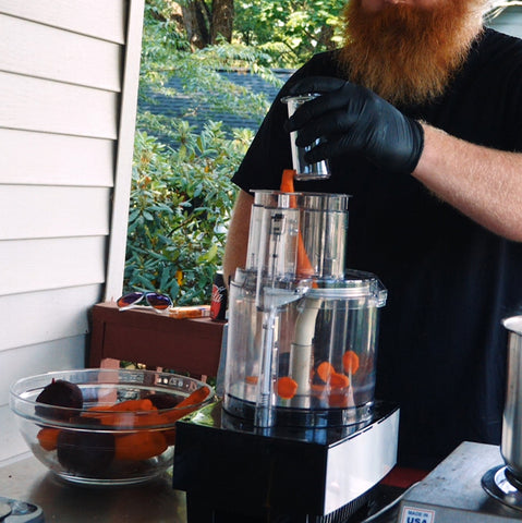 putting a carrot in a food processor