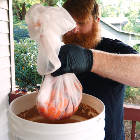 putting veggies into the fermenter