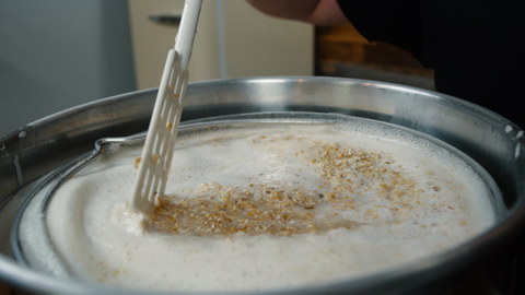 stirring mash to remove clumps