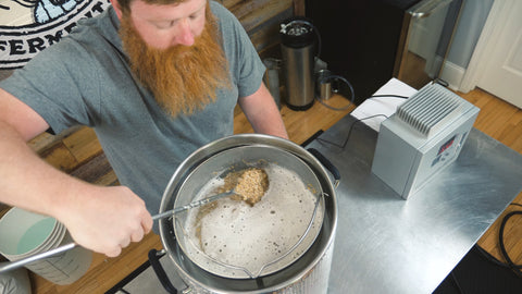 stirring mash to remove dough balls