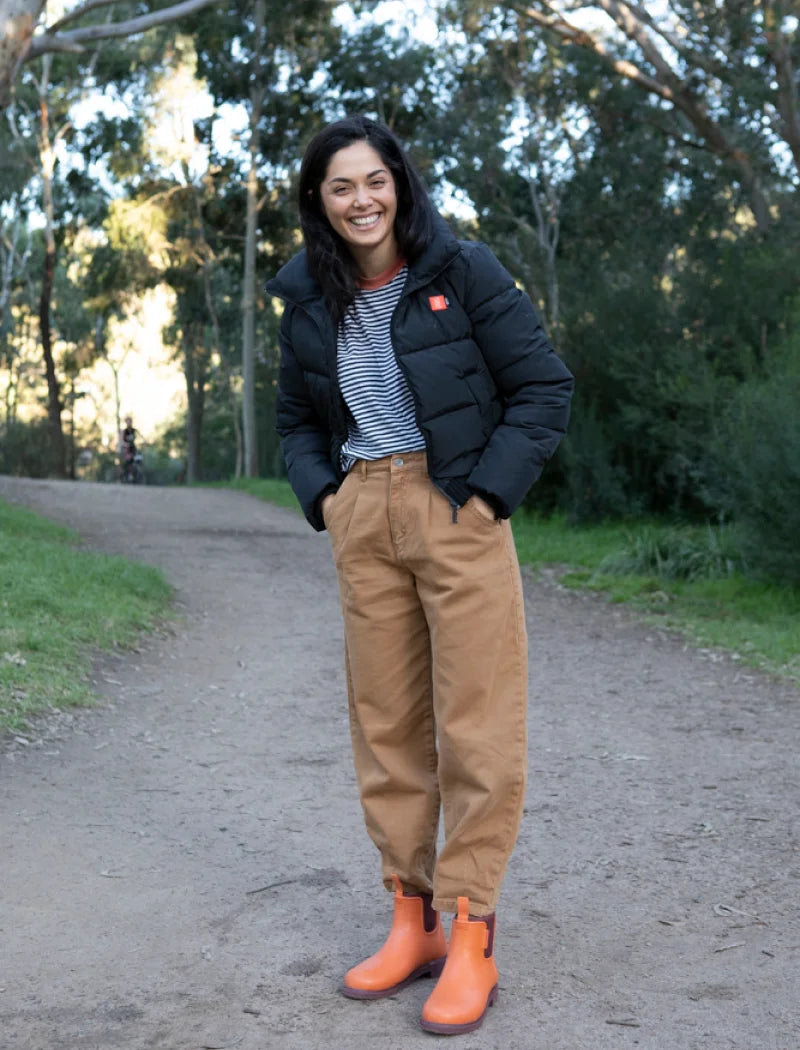 portrait of a casual fit wearing orange boots