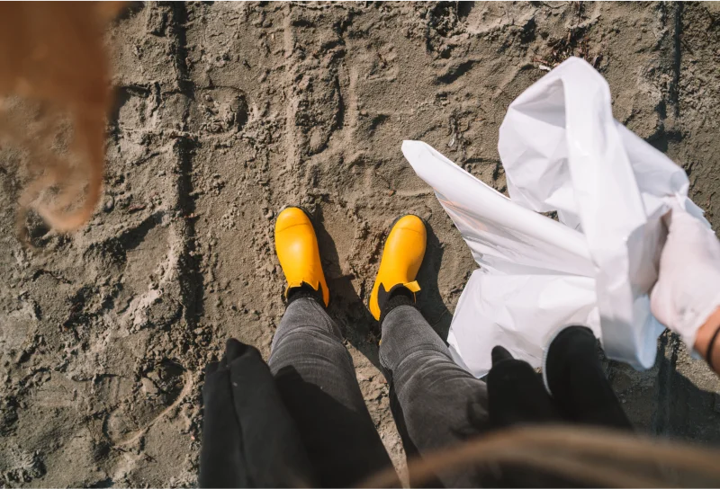 wearing mustard boots on the beach