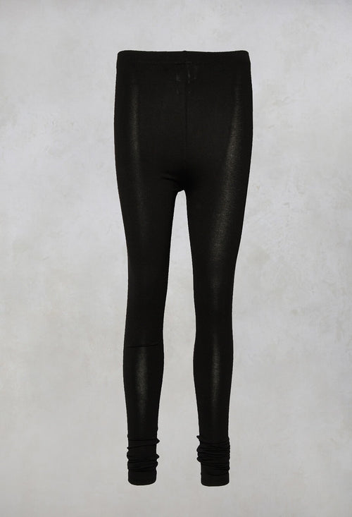 Black elastane shimmering leggings by Sarah Pacini