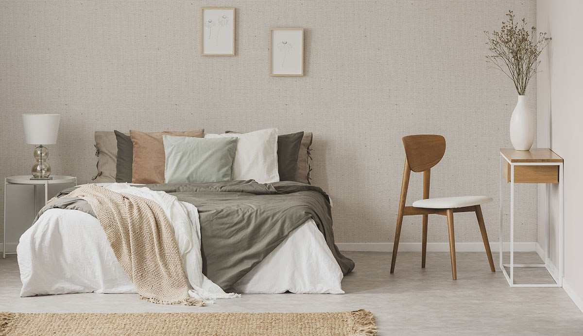 A bedroom featuring neutral and earth tones
