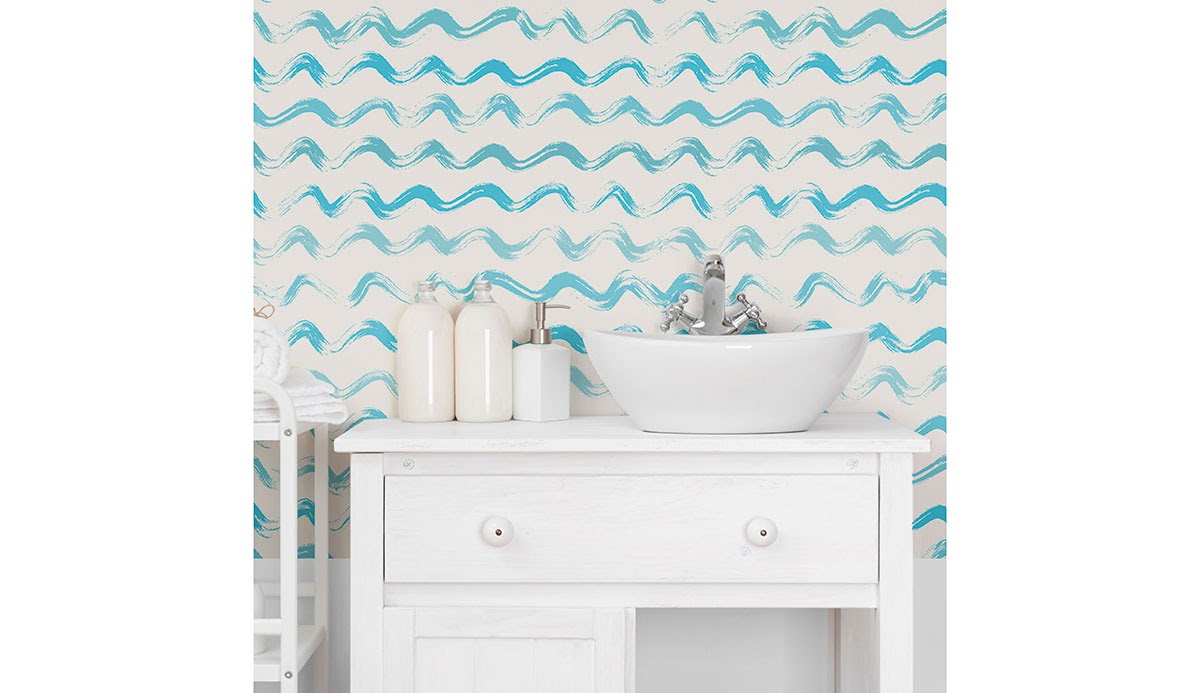 A light bathroom featuring blue wave-effect wallpaper