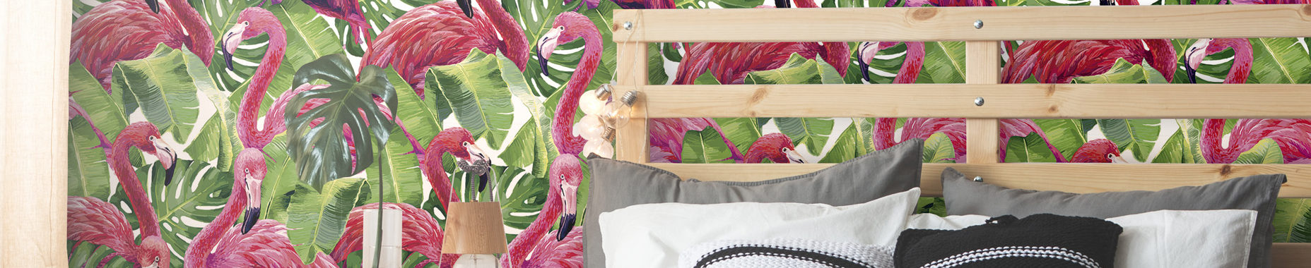 wooden bed with green leaves and pink flamingos wallpaper background
