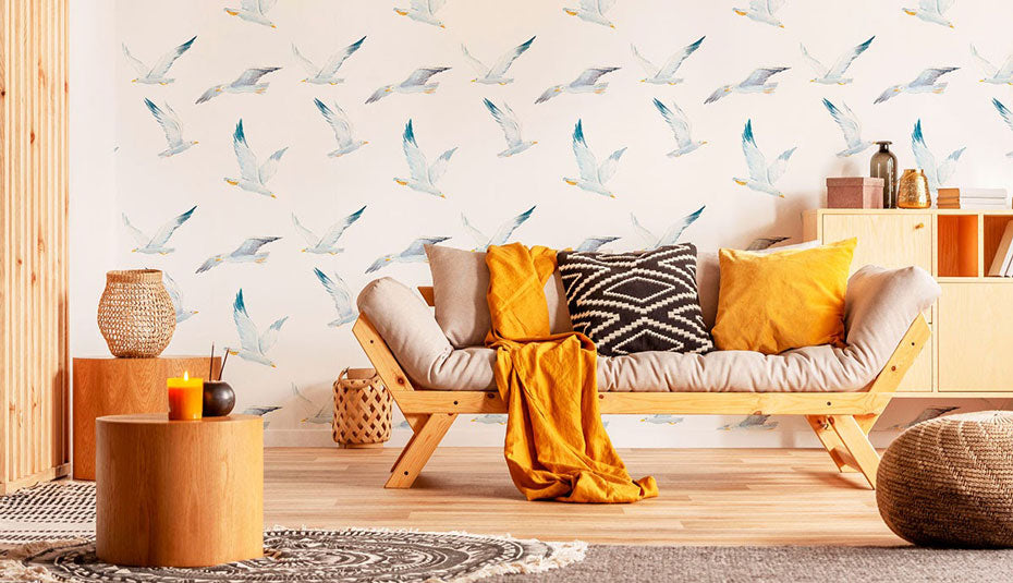  A living room with earth tone decor and bird removable wallpaper