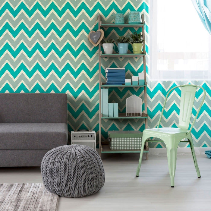 well decorated room with a touch of blue and green geometric pattern wallpaper