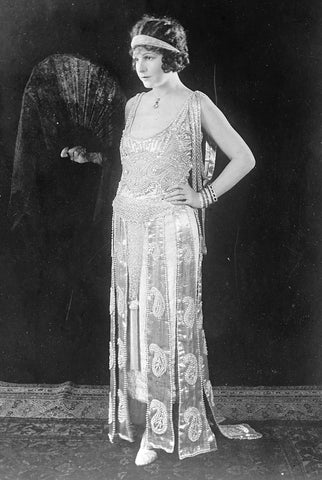 "Where there's smoke there's fire" by Russell Patterson, showing a fashionably dressed flapper in the 1920s.