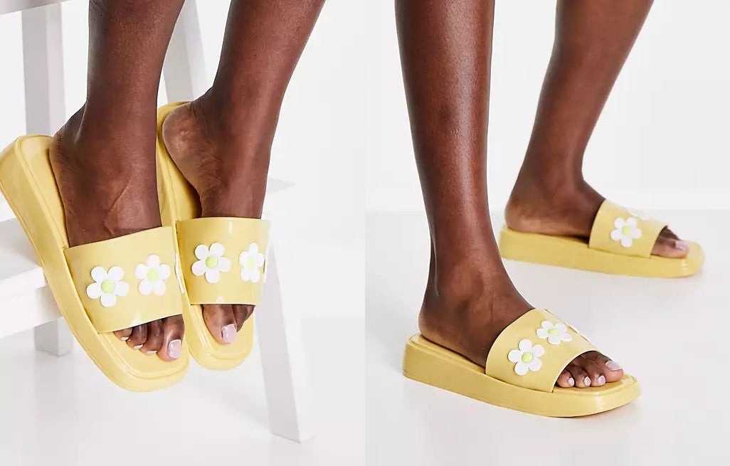 Website images showcasing ASOS DESIGN Flora Daisy Sliders in Yellow.