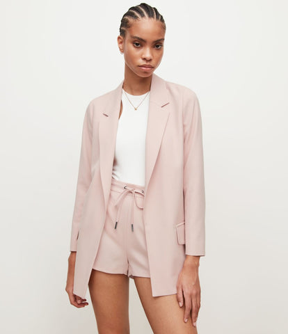 a website image showcasing a model wearing the ALL SAINTS Aleida Tri Blazer.