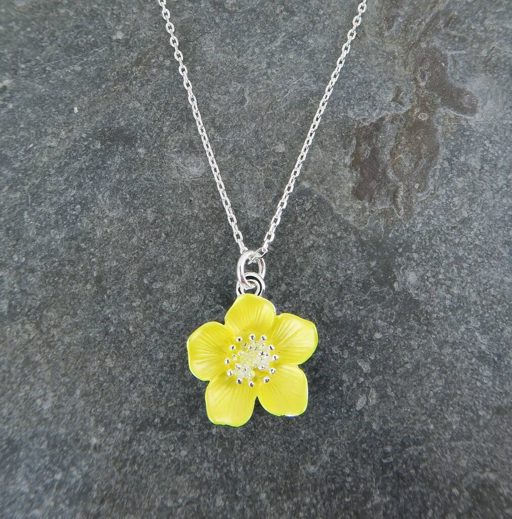 a close up image of a buttercup pendant neckline, in yellow.