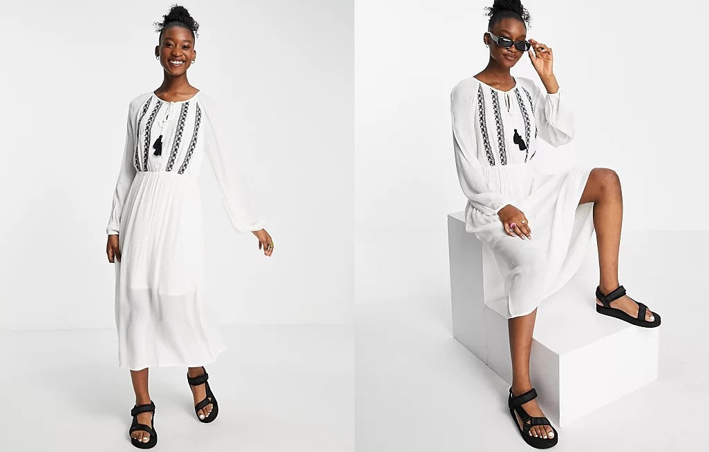 A model pictured wearing the En Creme Plus Long Sleeved Maxi Smock Dress from ASOS.