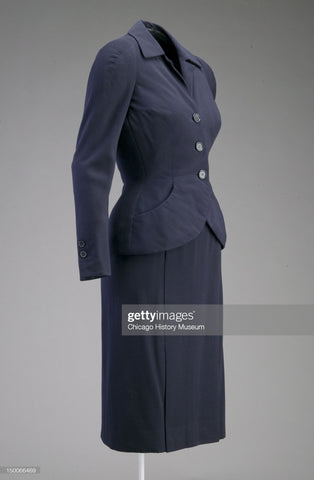 pictured is one of the first post-WWII creations by Dior - modelled it introduced formal attire with peplum beginnings in their 'Wool' collection.