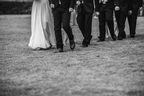 bride, groom, bridesmaids, groomsmen, walking, black and white 
